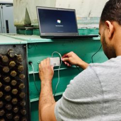 A person connecting a logger to a computer