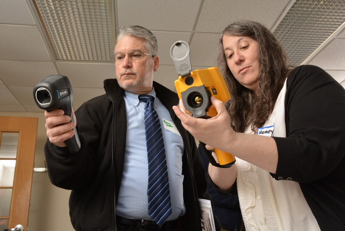 to people holding infrared cameras