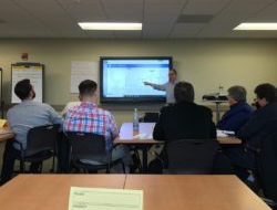 Classroom setting with an instructor and students